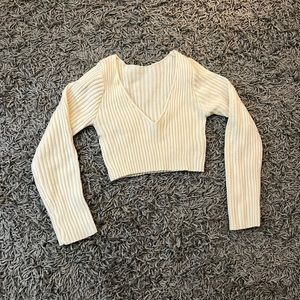 white long sleeved cropped sweater